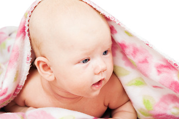 Image showing Little baby under multicolored towel