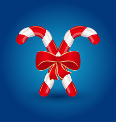 Image showing Christmas candy canes with red bow isolated