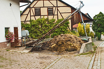 Image showing dung heap with crane