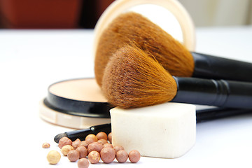 Image showing Makeup foundation, powder, bronzer and brushes