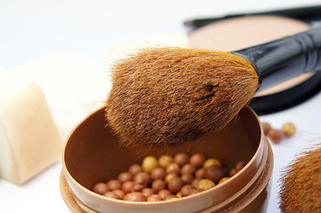 Image showing Makeup foundation, powder, bronzer and brushes