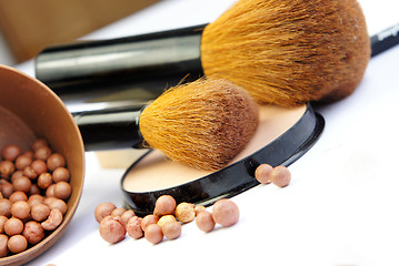 Image showing Makeup foundation, powder, bronzer and brushes