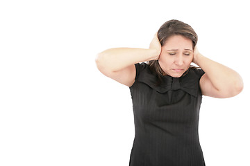 Image showing Stressed young woman covering his ears, grimacing and gesturing 