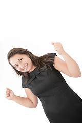 Image showing Woman with orthodontics enjoying success with clenched fists