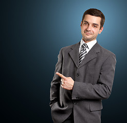 Image showing Business Man Shows Something With Finger