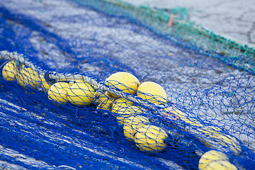 Image showing fishnet trawl rope putdoor in summer at harbour