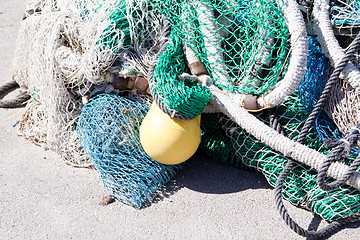 Image showing fishnet trawl rope putdoor in summer at harbour