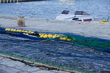 Image showing fishnet trawl rope putdoor in summer at harbour