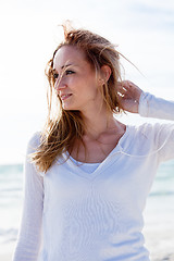 Image showing beautiful young woman relaxing at beach in summer 