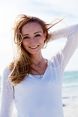 Image showing beautiful young woman relaxing at beach in summer 