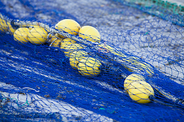 Image showing fishnet trawl rope putdoor in summer at harbour