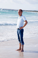 Image showing young man is relaxing on beach in summer vacation