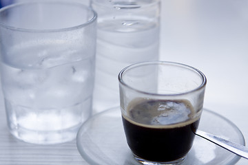 Image showing hot aromatic espresso cup and cold water in glass