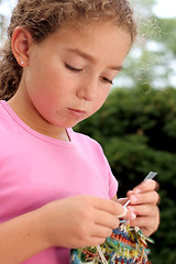 Image showing Cute girl knitting