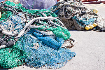 Image showing fishnet trawl rope putdoor in summer at harbour