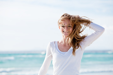 Image showing beautiful young woman relaxing at beach in summer 