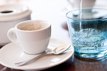 Image showing hot aromatic espresso cup and cold water in glass