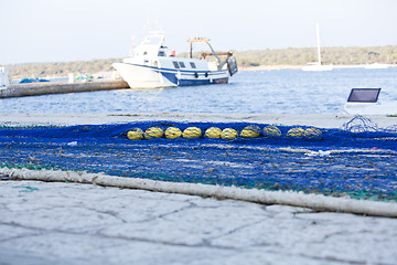 Image showing fishnet trawl rope putdoor in summer at harbour