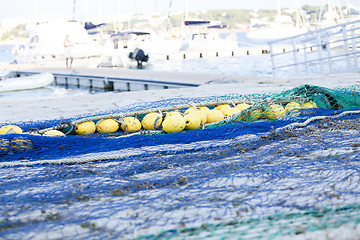 Image showing fishnet trawl rope putdoor in summer at harbour