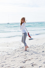 Image showing beautiful young woman relaxing at beach in summer 