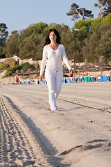 Image showing beautiful young woman relaxing at beach in summer 