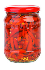 Image showing Glass jar with marinated red chili peppers