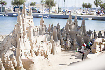 Image showing creative big sandcastle on the beauch in summer