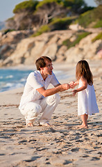 Image showing happy family father and daughter on beach having fun