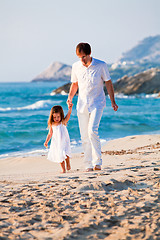 Image showing happy family father and daughter on beach having fun