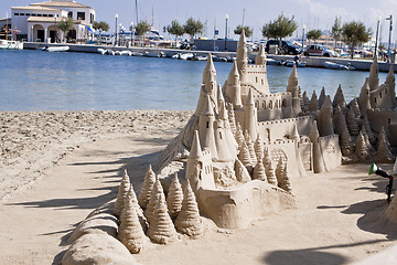 Image showing creative big sandcastle on the beauch in summer