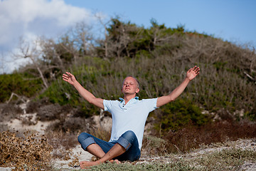 Image showing young man is relaxing outdoor in dune in summer