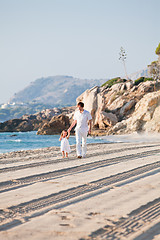 Image showing happy family father and daughter on beach having fun