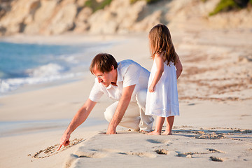 Image showing happy family father and daughter on beach having fun