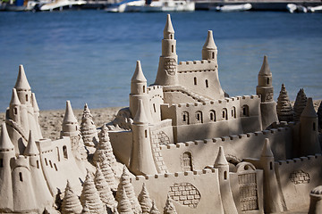 Image showing creative big sandcastle on the beauch in summer