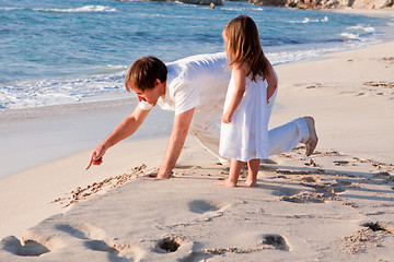 Image showing happy family father and daughter on beach having fun