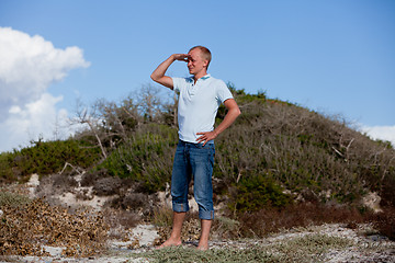 Image showing young man is relaxing outdoor in dune in summer