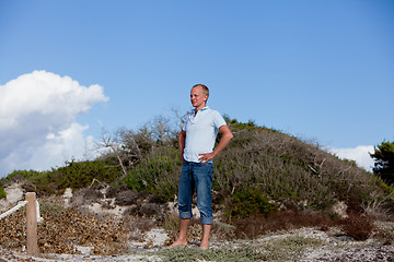 Image showing young man is relaxing outdoor in dune in summer