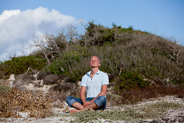 Image showing young man is relaxing outdoor in dune in summer