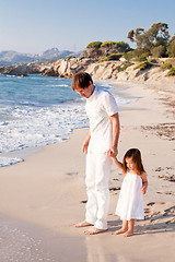 Image showing happy family father and daughter on beach having fun