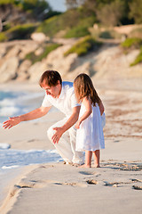 Image showing happy family father and daughter on beach having fun