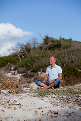 Image showing young man is relaxing outdoor in dune in summer