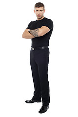 Image showing Bouncer with tattoo on hand posing with arms crossed