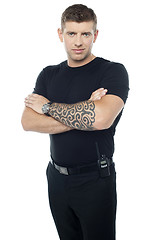 Image showing Bouncer with walkie-talkie. Tattoo on hands