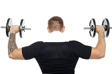 Image showing Back pose of male bodybuilder lifting weights