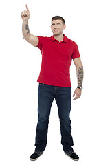 Image showing Handsome guy pointing upwards