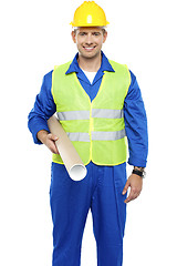 Image showing Experienced male architect carrying blueprints