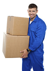 Image showing Relocation assistant staff carrying cardboard boxes