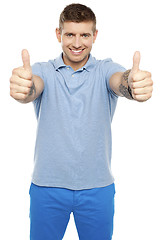 Image showing Joyous caucasian male showing double thumbs up