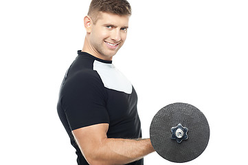 Image showing Side pose of gym instructor lifting weights