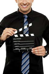 Image showing Cropped image of man with clapboard